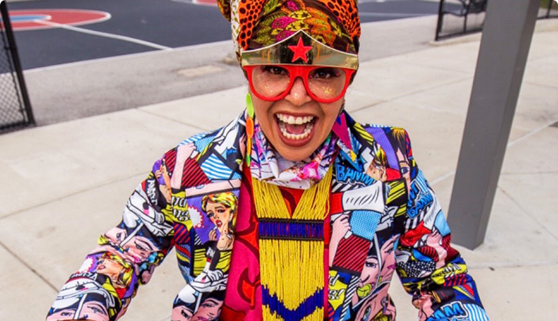 A vibrant picture of the performer Starfire, emcee of the Philadelphia Inquirer Food Festival, Happening November 15th, 2025 at the Fillmore.